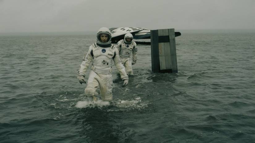 Astronauts (including Anne Hathaway) wade through rising waters in interstellar