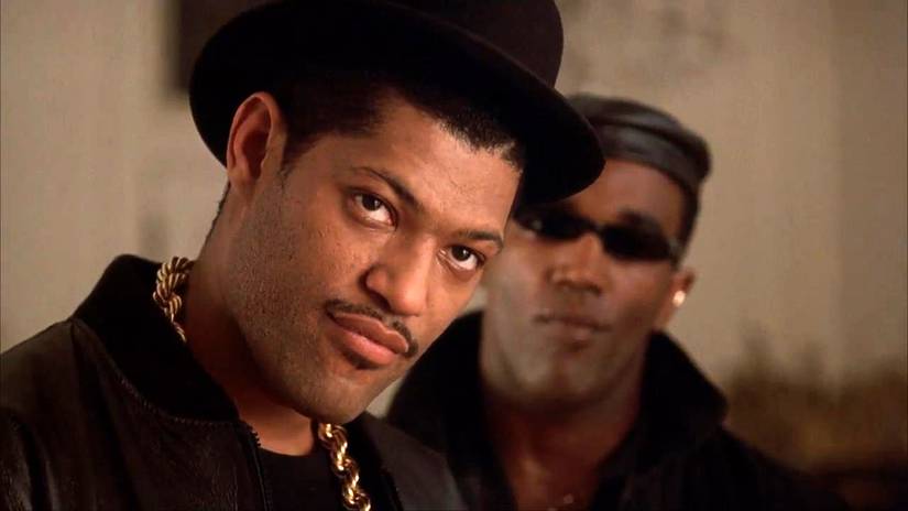 Laurence Fishburne wearing a hat and gold chain in "The King of New York."