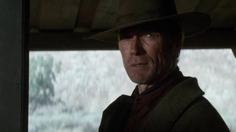 Clint Eastwood in Unforgiven wearing a hat and coat