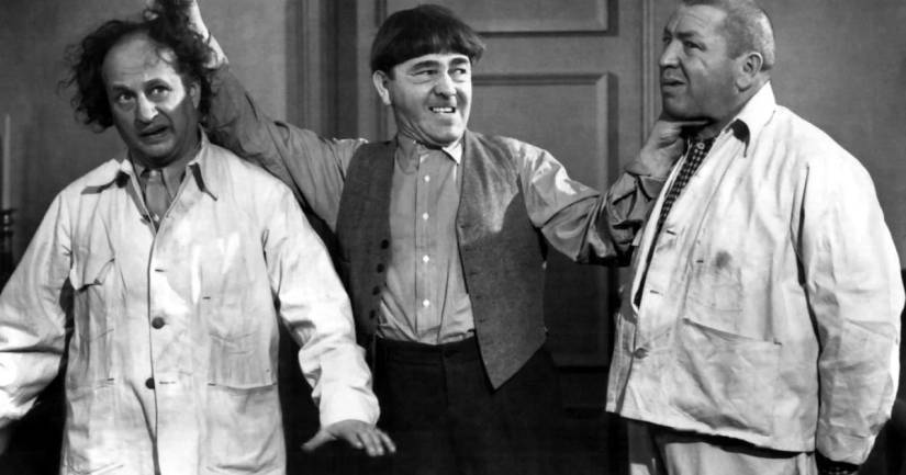 Larry Fine, Moe Howard, and Curly Howard as "The Three Stooges"