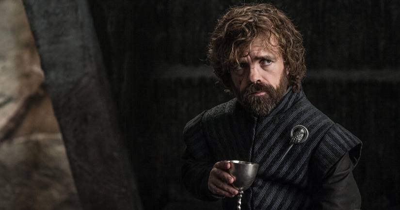 Game of Thrones cast: Tyrion holding a cup of wine. 