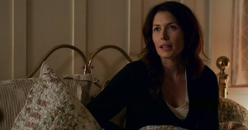 Charmaine sits in bed in Virgin River