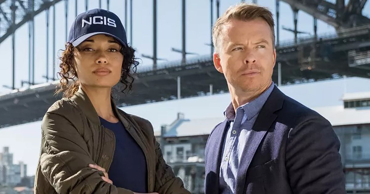 Olivia Swann and Todd Lasance in NCIS: Sydney standing in front of a bridge