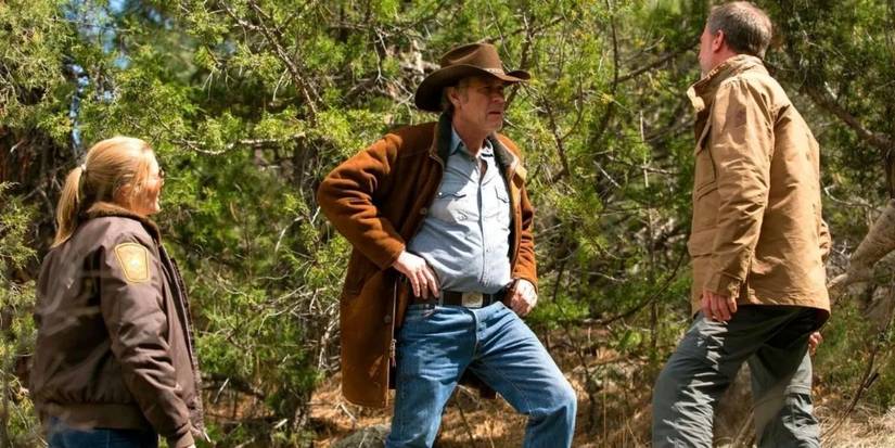 Two men and a woman standing and talking