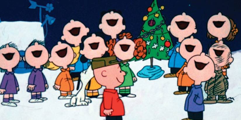 A group of kids sing joyously by a Christmas tree in A Charlie Brown Christmas