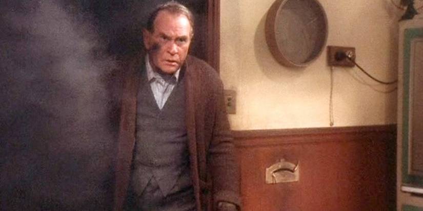 Darren McGavin angrily comes out of furnace room in A Christmas Story (1983)