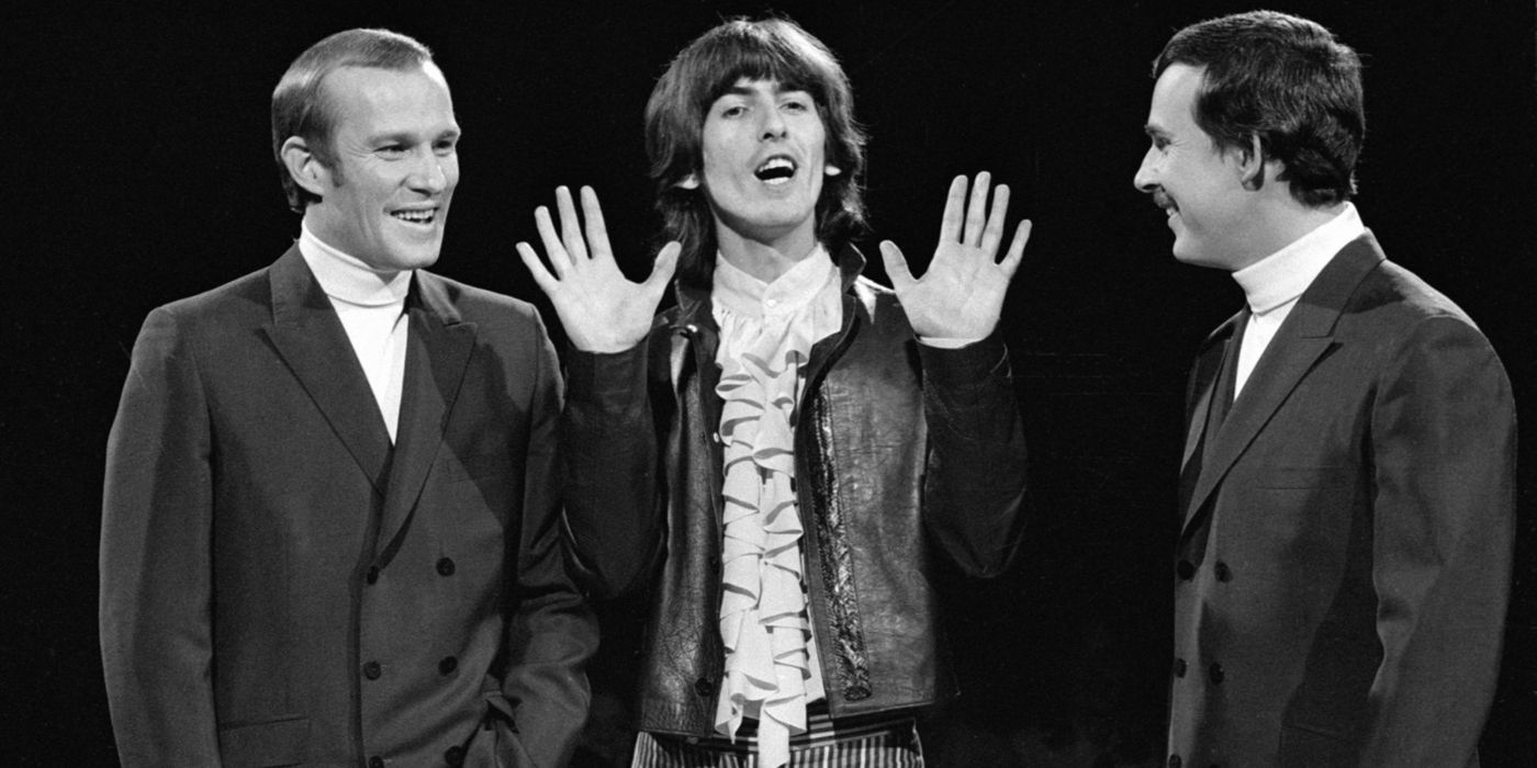 Dick Smothers and Tom Smothers with a guest on stage in The Smothers Brothers Comedy Hour