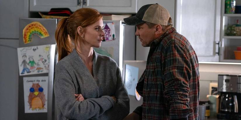 Sarah Rafferty as Katherine and Marc Blucas as George talking in their kitchen in My Life With the Walter Boys