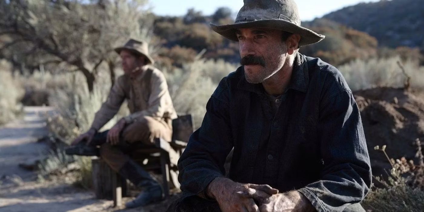 Daniel Day Lewis as Daniel Plainview, crouching in the desert, in There Will Be Blood 