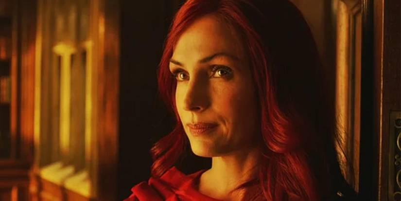 Famke Janssen as Phoenix, with red hair and a red dress, in X-Men: The Last Stand