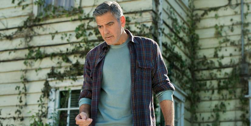 George Clooney standing in front of a house as Frank Walker in Tomorrowland