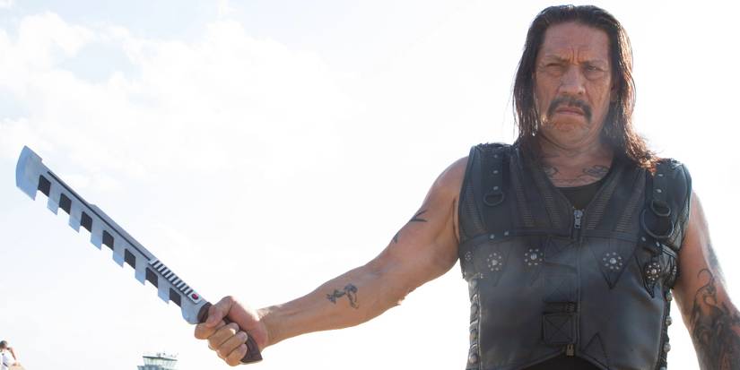 Danny Trejo as Machete wielding a machete in Machete