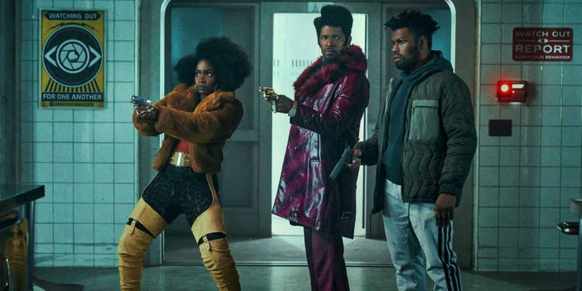 Teyonah Paris, Jamie Foxx, and John Boyega in They Cloned Tyrone