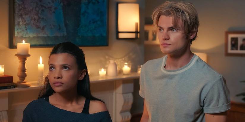 Nikki Rodriguez as Jackie and Noah LaLonde as Cole looking at something off-screen in My Life With the Walter Boys