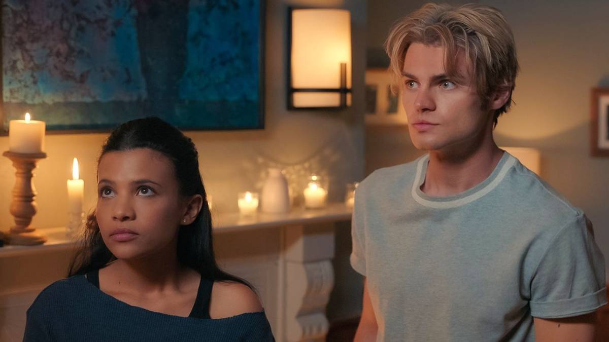 Nikki Rodriguez as Jackie and Noah LaLonde as Cole looking at something off-screen in My Life With the Walter Boys