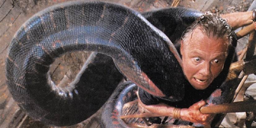 Jon Voight gets attacked by a huge anaconda in the film anaconda