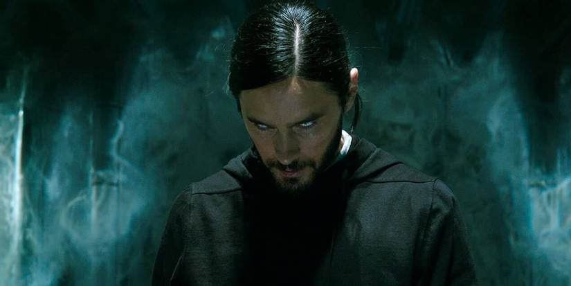 Jared Leto as Michael Morbius wearing a black hoodie looking up at something off-screen in Morbius