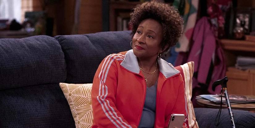 Wanda Sykes gives a pointed look at Lucretia while sitting on a couch in The Upshaws