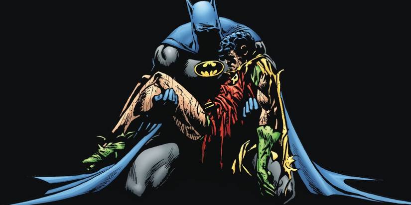 Batman holding dead Jason Todd/Robin in his arms with darkness behind him in DC's Death in the Family comic