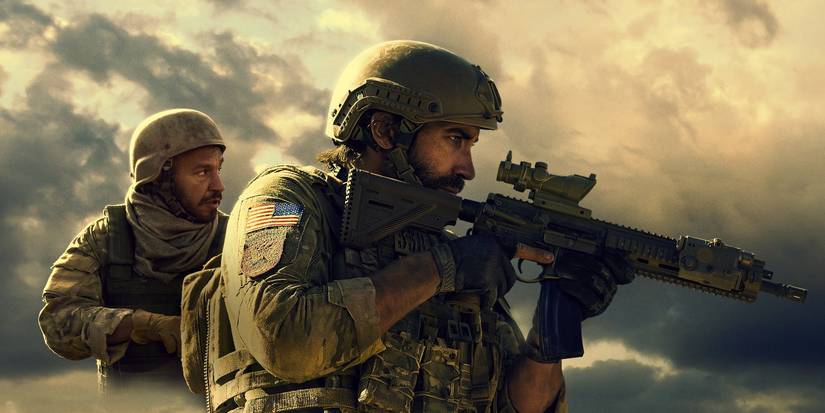 Jake Gyllenhaal and Dar Salim in Guy Ritchie's The Covenant wearing military gear and holding rifles