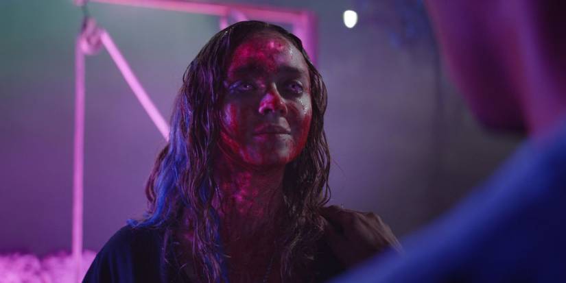 A girl with glass eyes looks possessed in the film color out of space
