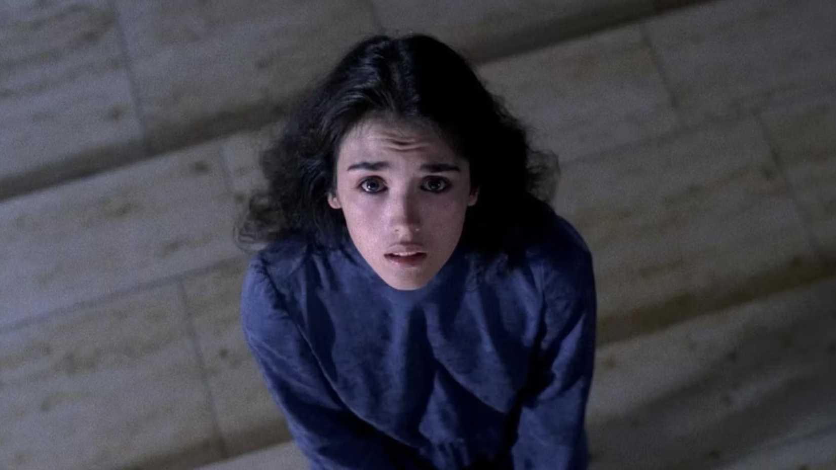Isabelle Adjani looks up at the camera with a worried stare in a scene from Possession