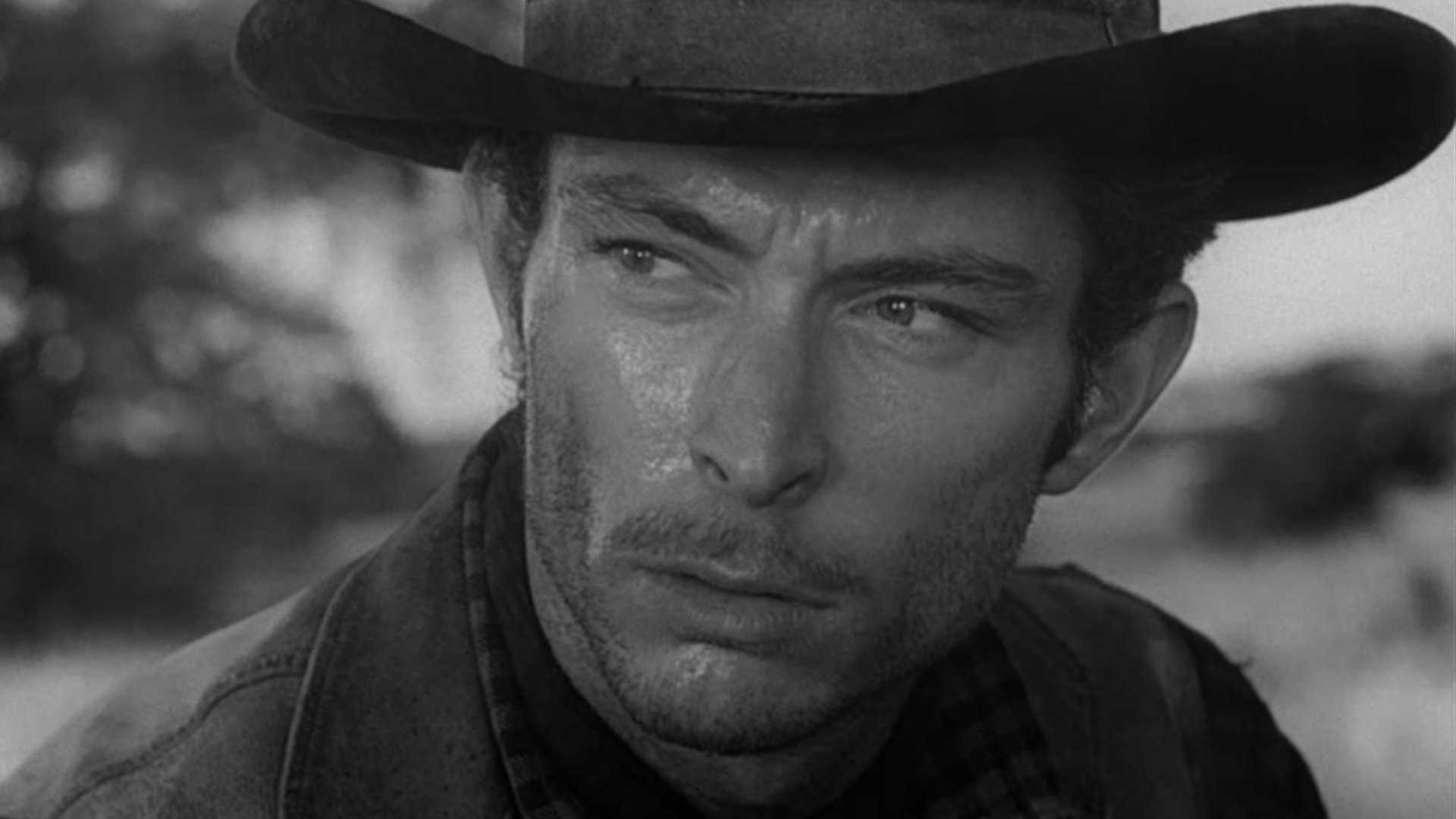 Black and white close-up of Lee Van Cleef wearing a cowboy hat in High Noon
