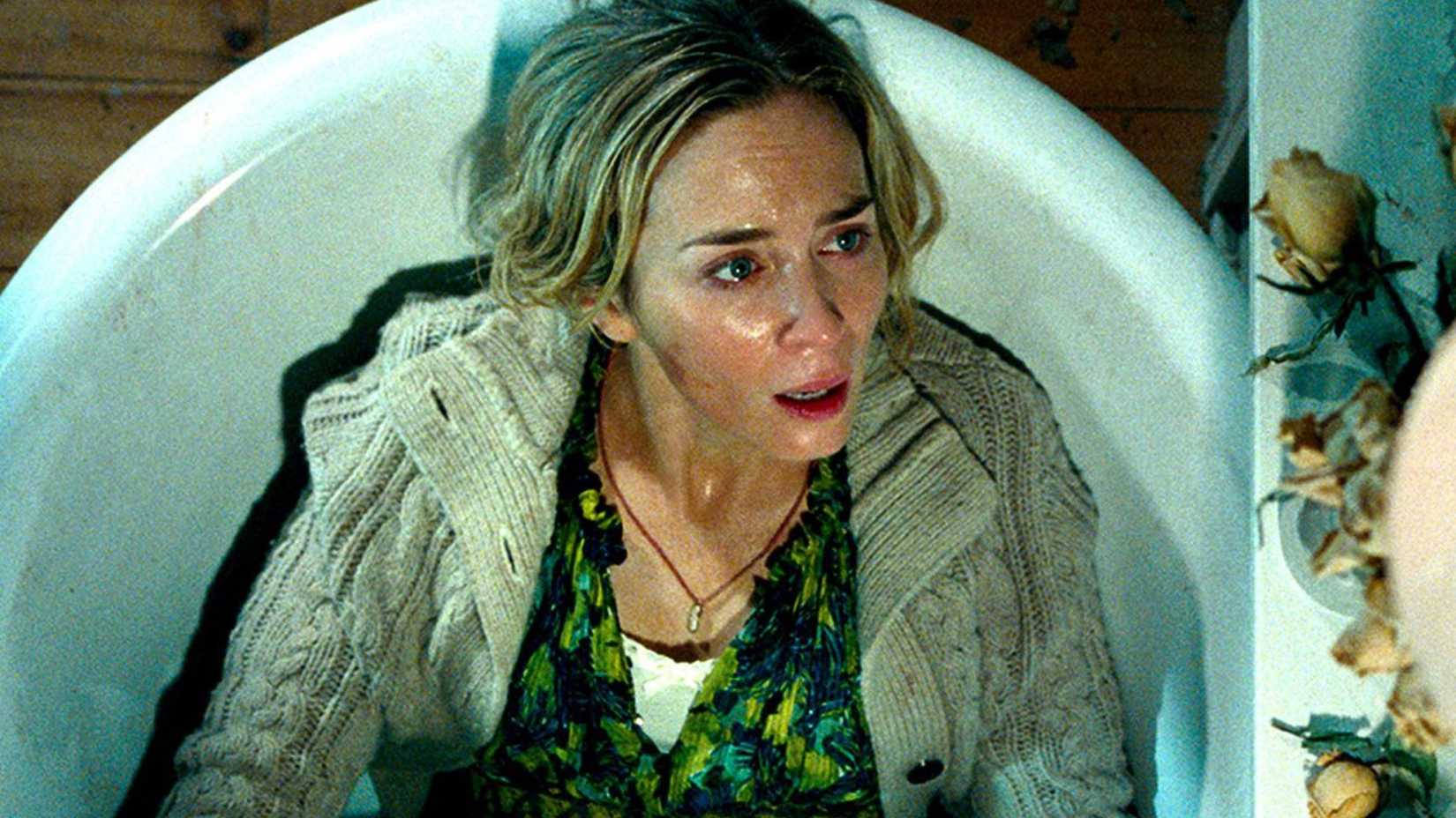 Emily Blunt hides in a bathtub in A Quiet Place