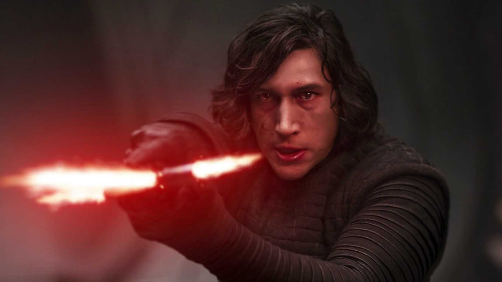 Adam Driver as Kylo Ren with his lightsaber in Star Wars the Force Awakens
