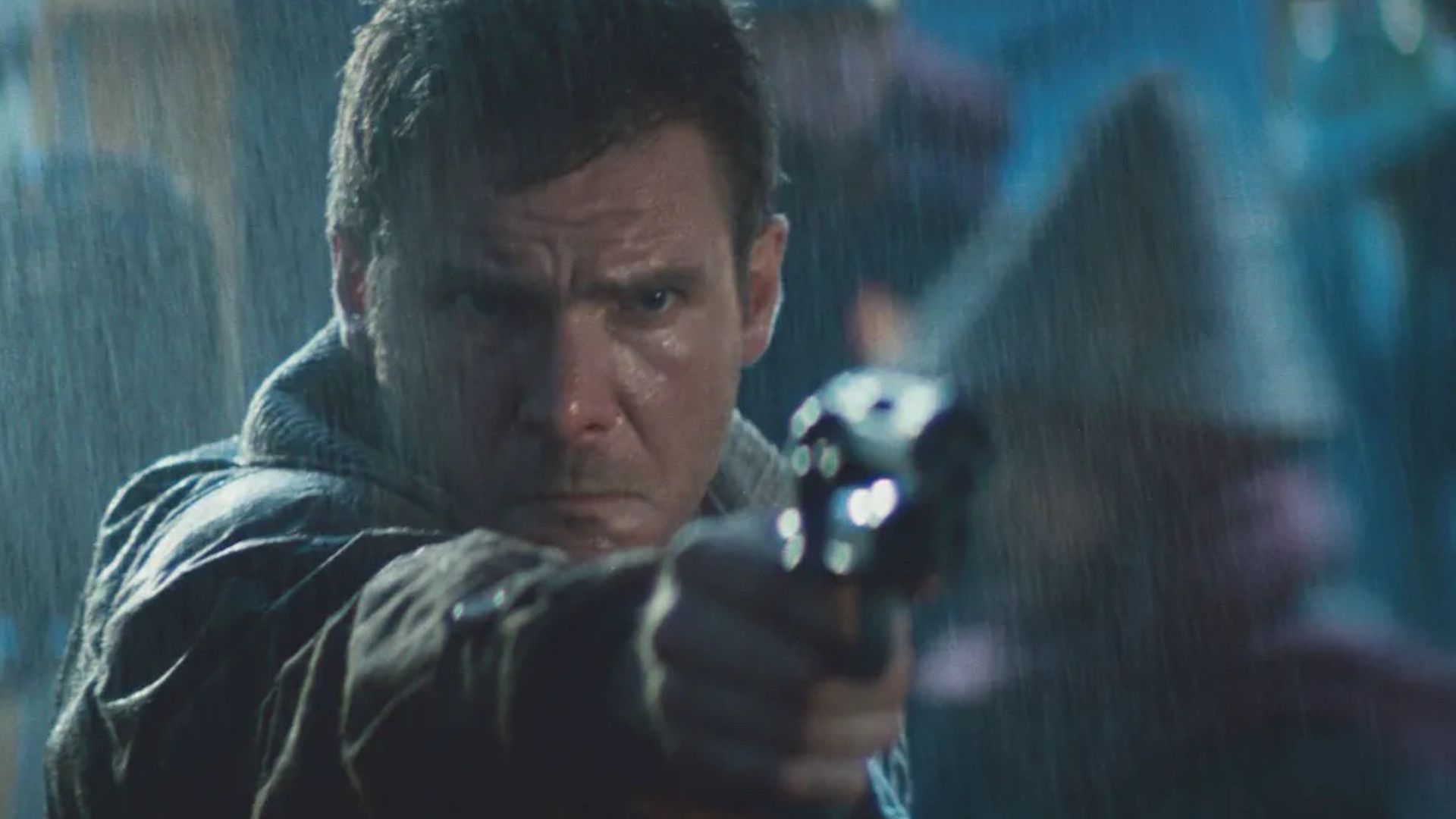 Harrison Ford in Blade Runner standing in the rain and aiming a gun
