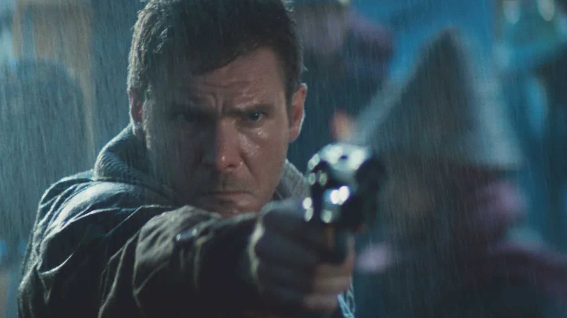 Harrison Ford in Blade Runner standing in the rain and aiming a gun