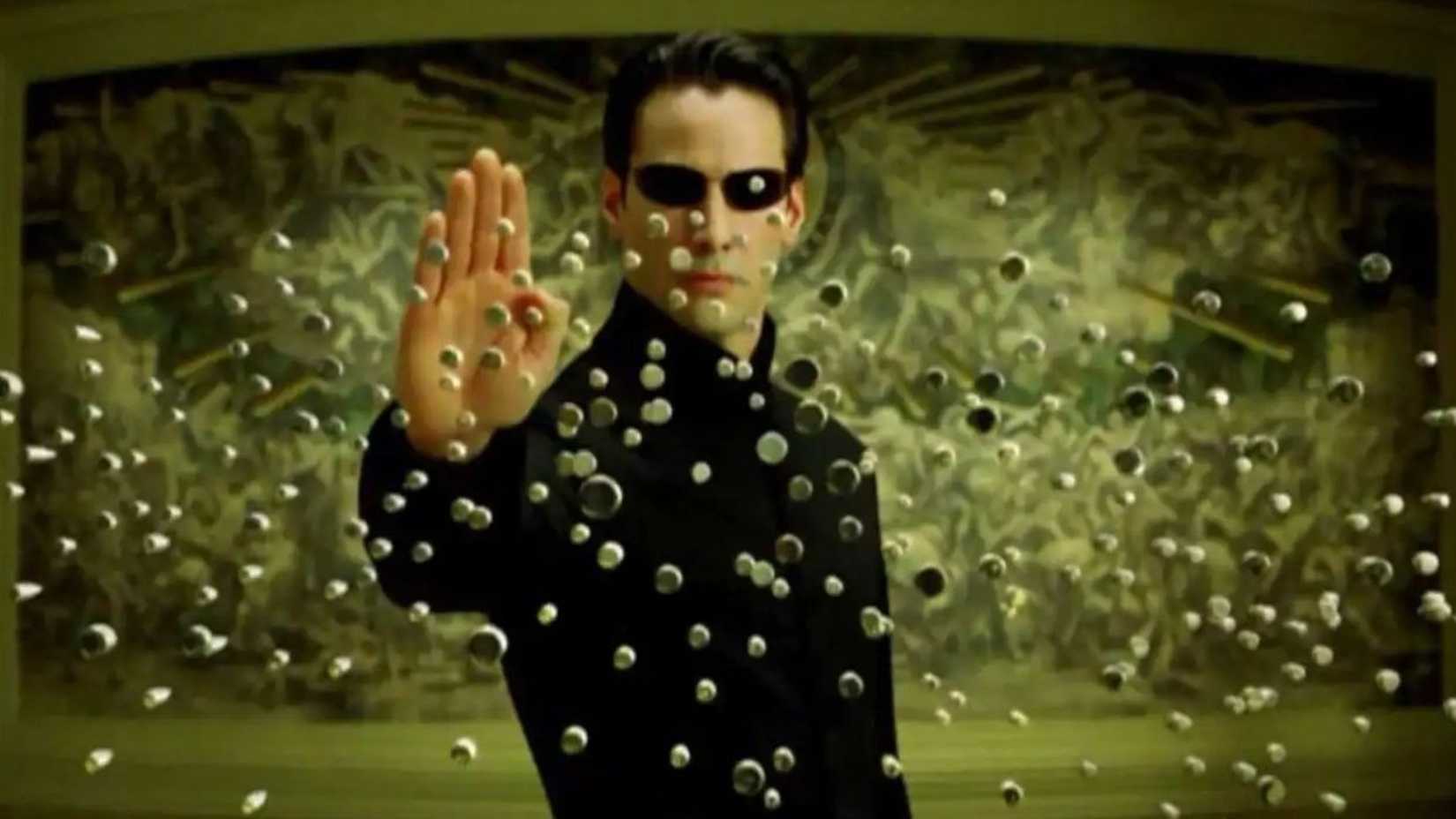 Keanu Reeves' Neo stopping bullets in The Matrix
