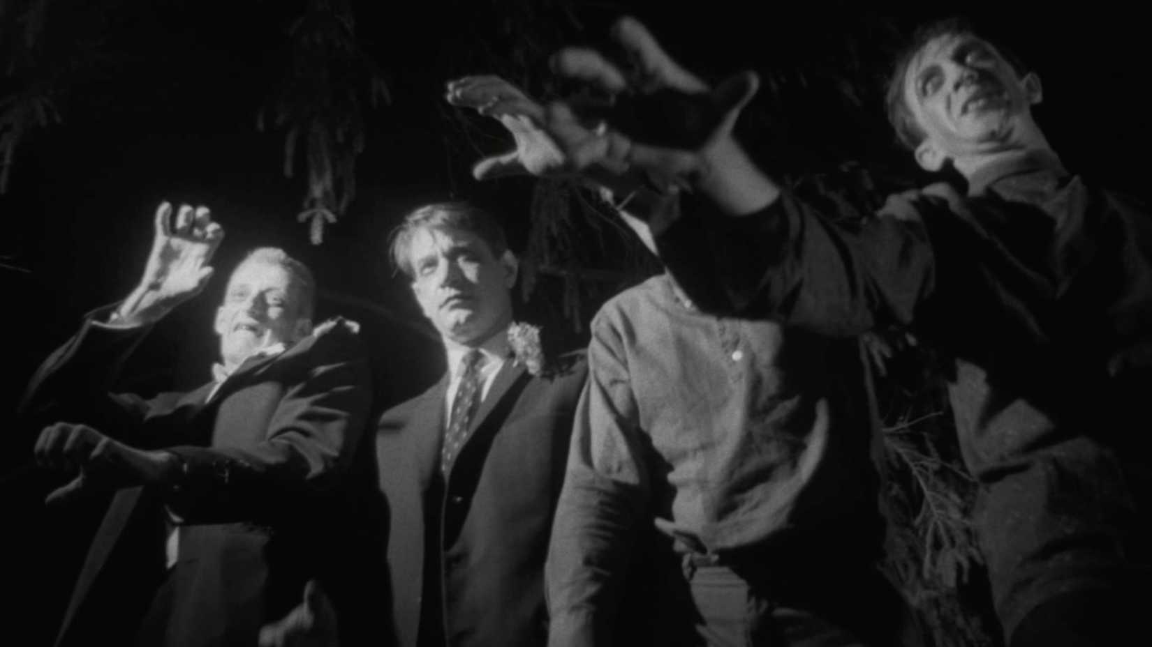 zombies look menacing in the film night of the living dead