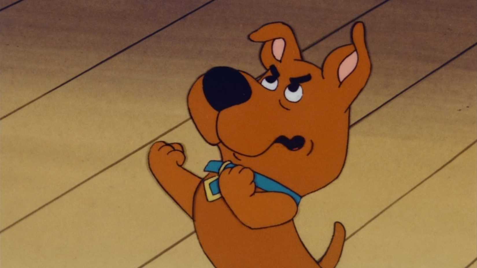 Scrappy Doo holding up his fists in the animated Scooby Doo series