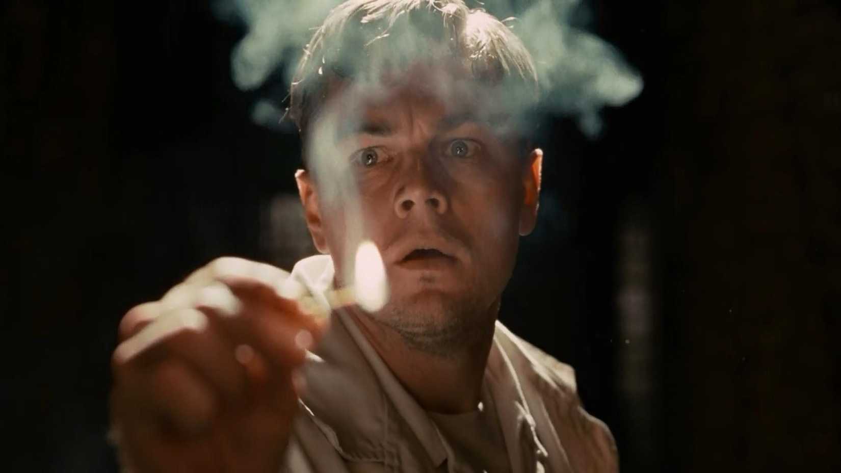 Leonardo DiCaprio lights a match in Shutter Island
