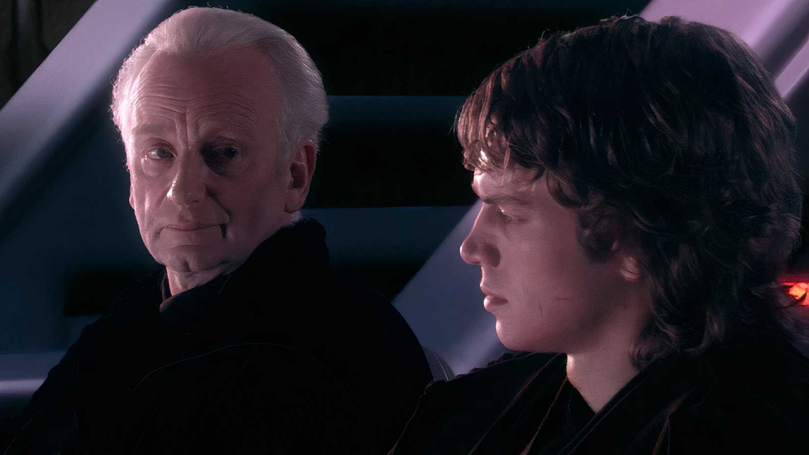 Palpatine and Anakin sitting in a futuristic opera house in Star Wars Revenge of the Sith