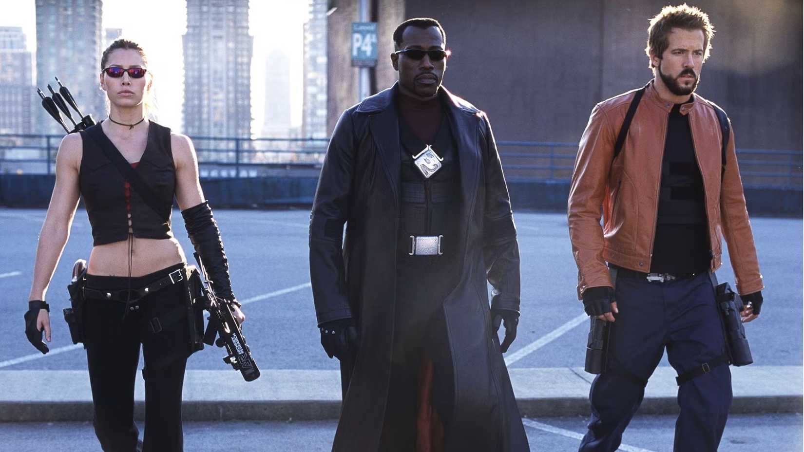 Wesley Snipes as Blade walking on top of a parking garage with Ryan Reynolds in Blade: Trinity