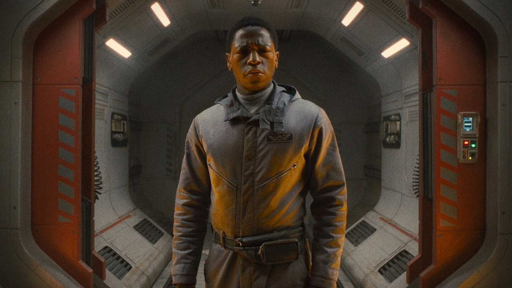 David Jonsson in Alien Romulus standing in a spaceship hallway
