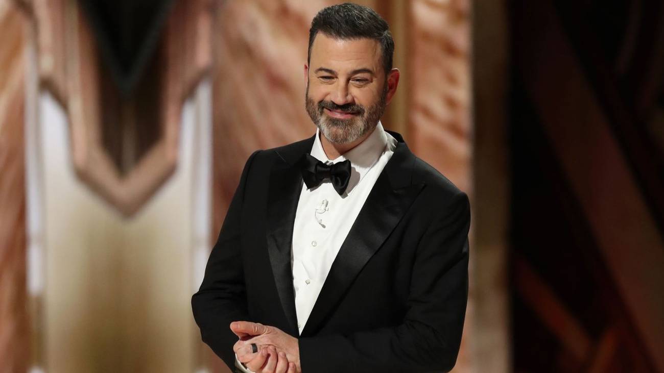 Jimmy Kimmel holding his hands while hosting the Academy Awards