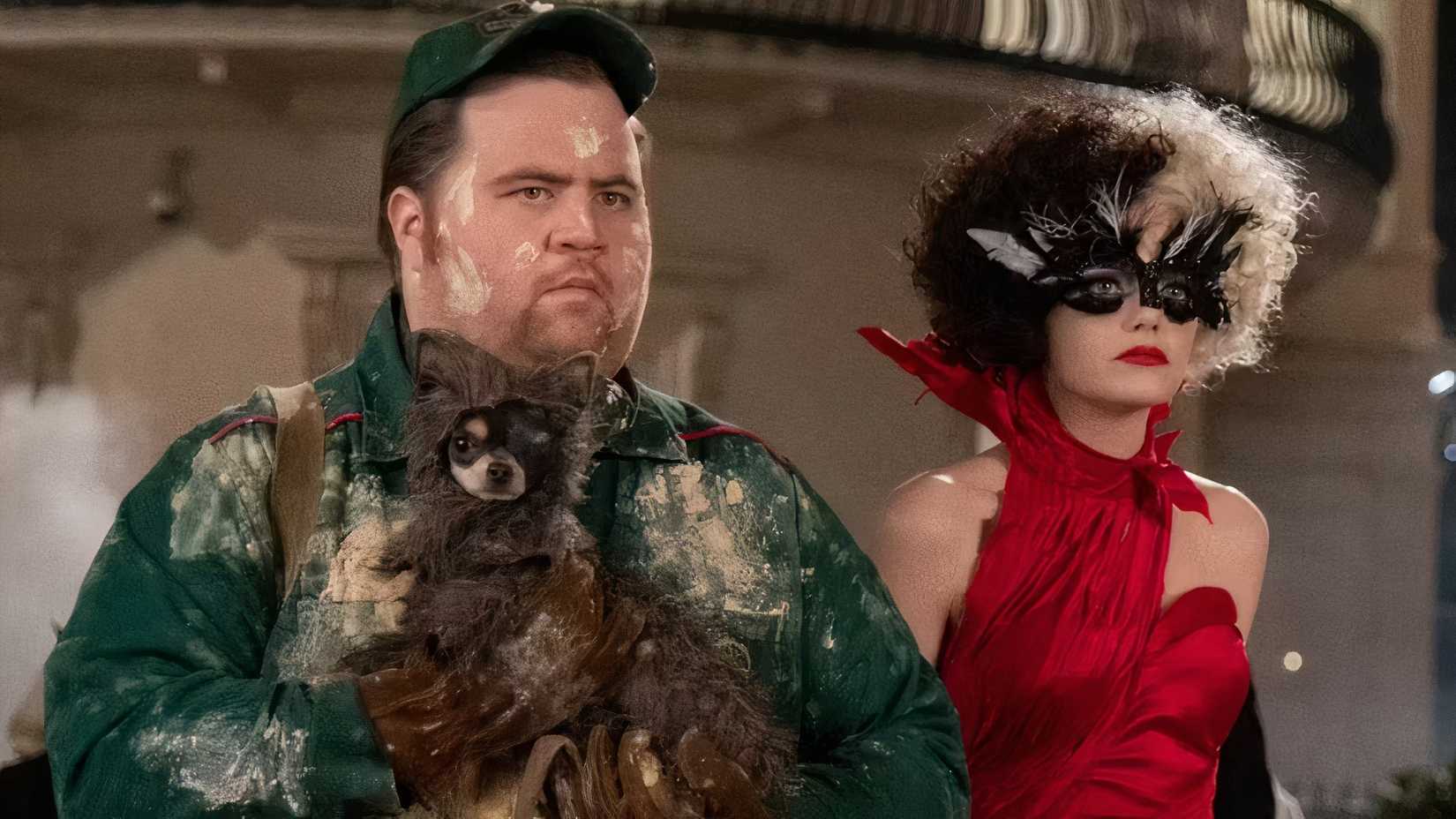 Paul Walter Hauser holds a dog beside Emma Stone in Cruella