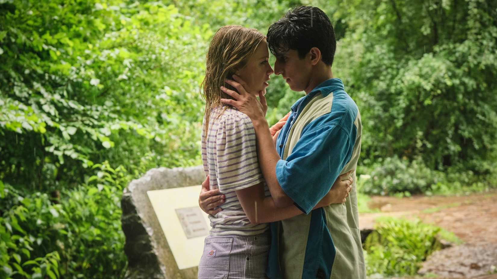Andie and Sal in A Good Girl's Guide to Murder looking into each other's eyes in the woods