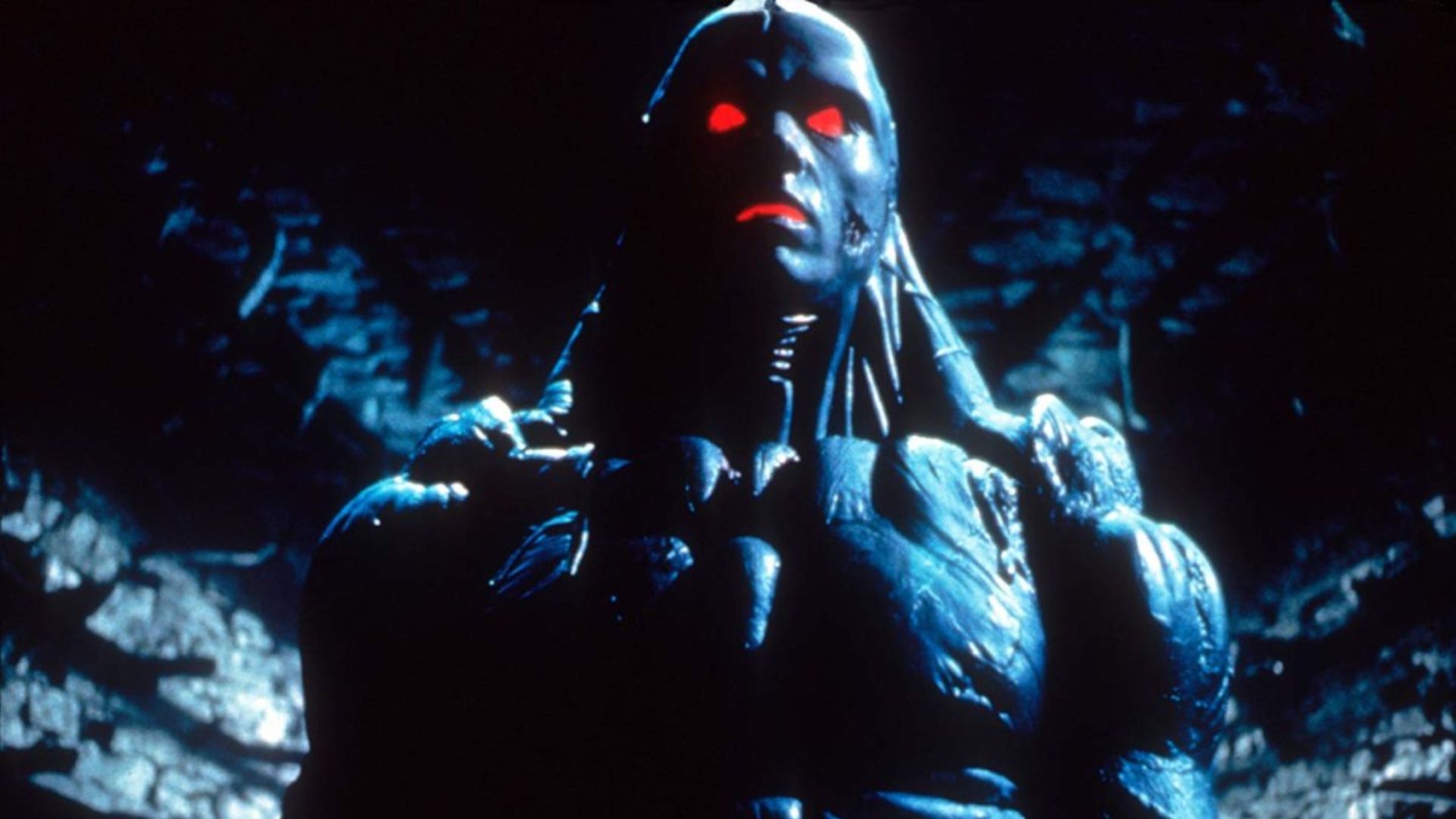 a humanoid figure with red eyes and mouth in the film the keep