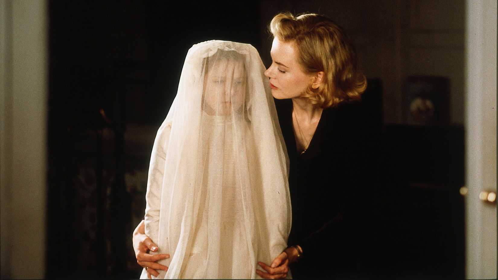 Nicole Kidman comforts her daughter in The Others