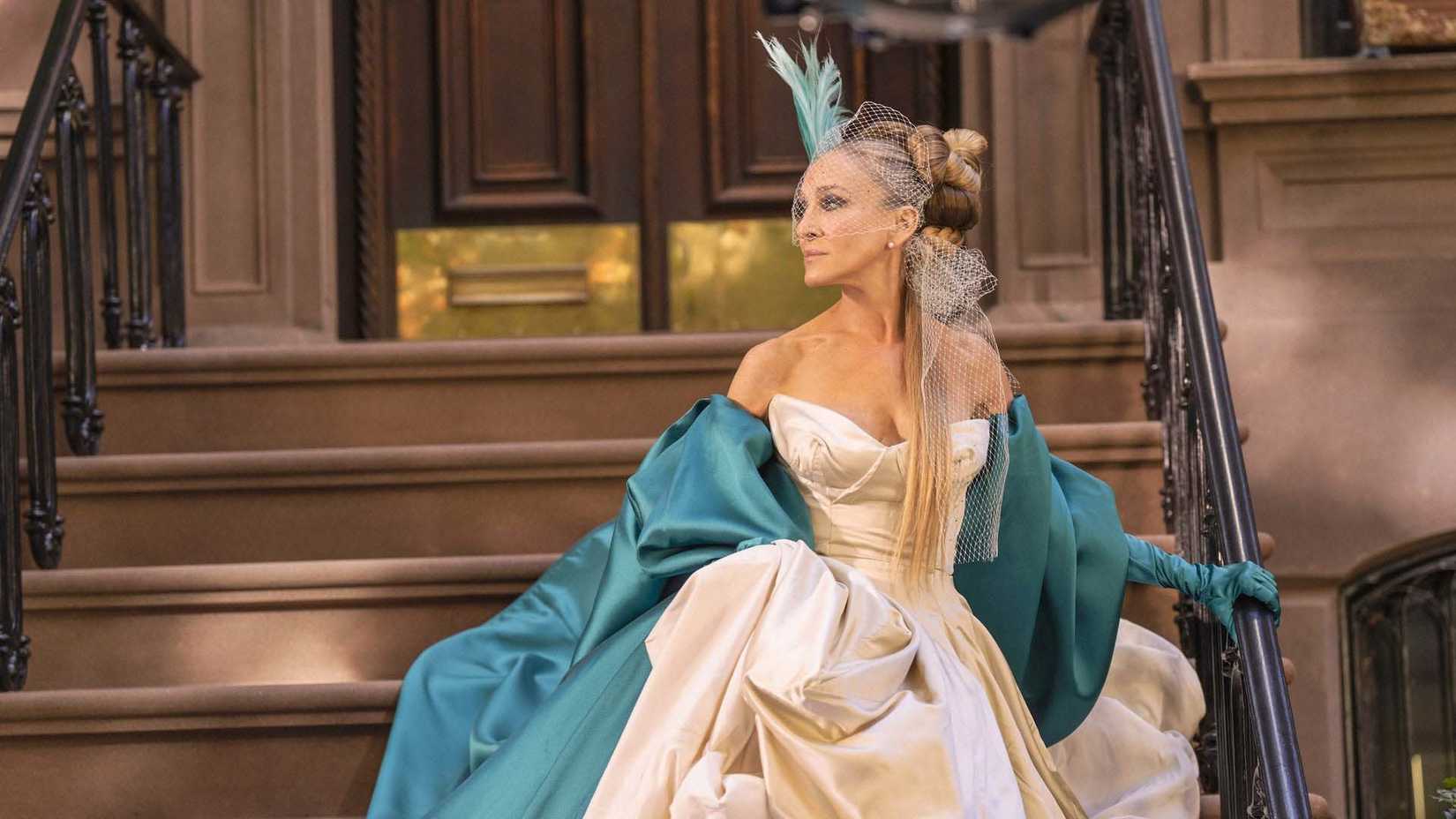 Carrie in a wonderful dress walking down stairs in And Just Like That...