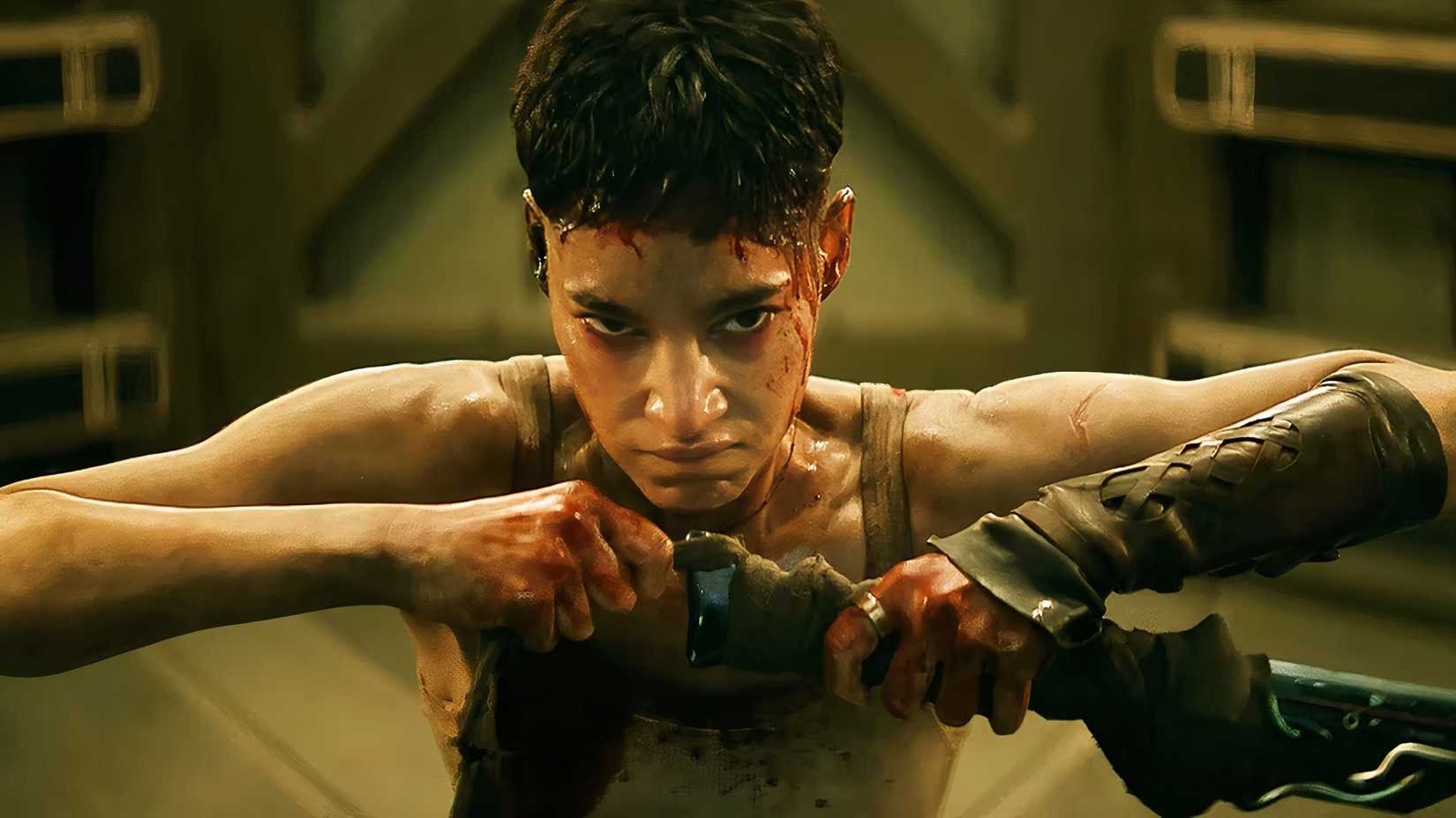 Sofia Boutella in Rebel Moon Director's Cut holding a weapon