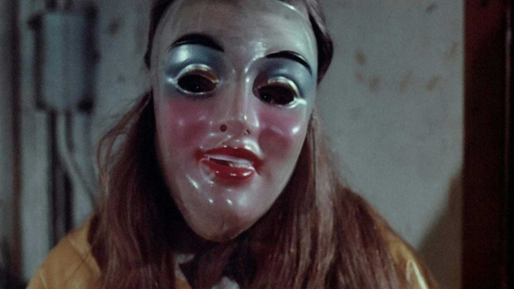 A young girl wearing a mask in Alice, Sweet Alice (1976)