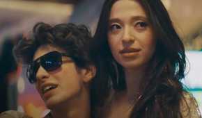 Mikey Madison in Anora smiling and looking off-screen
