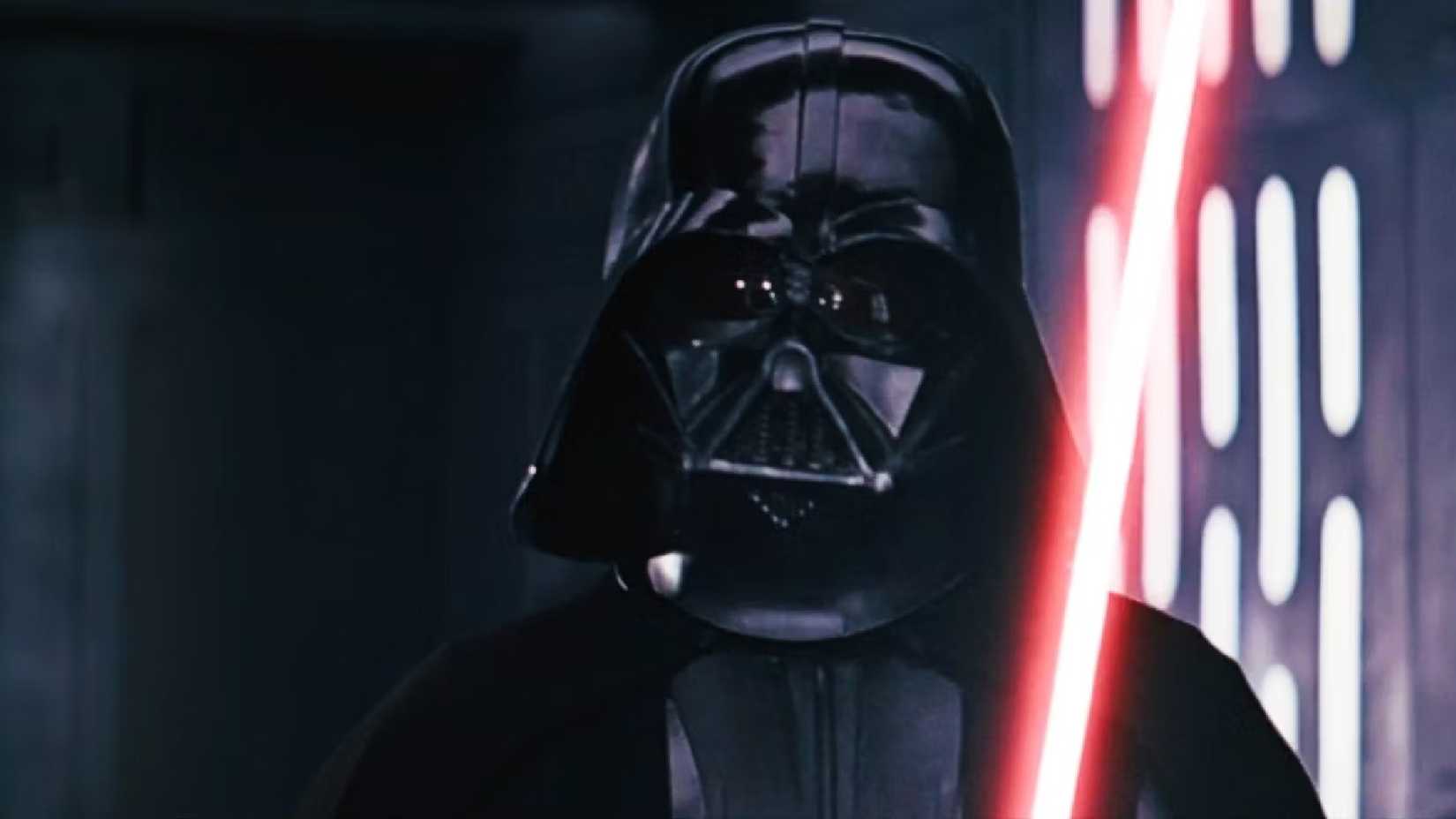 Darth Vader with his red lightsaber in Star Wars