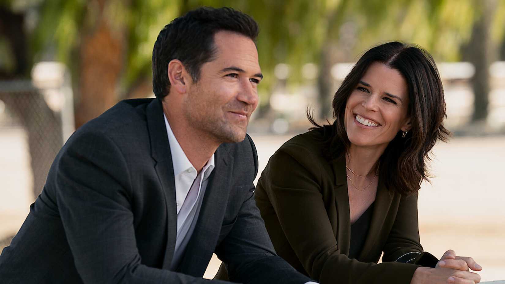 Mickey and Maggie together smiling on The Lincoln Lawyer