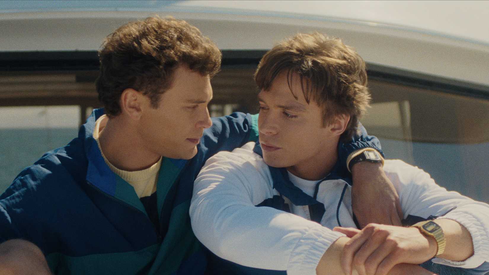 Erik and Lyle Menendez on a boat, hugging one another in Monsters: The Lyle and Erik Menendez Story